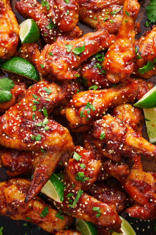 Crispy baked chicken wings on baking sheet.