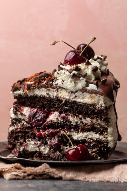 Featuring moist chocolate cake layers, a fresh cherry filling, and a light whipped cream frosting, my mile-high Black Forest cake is a total showstopper! Make it even more stunning by garnishing with mini chocolate chips pressed up the side of the cake, and chocolate shavings and fresh cherries on top. Beautiful, delicious, and surprisingly easy, this cake is sure to be the star of your dessert table!