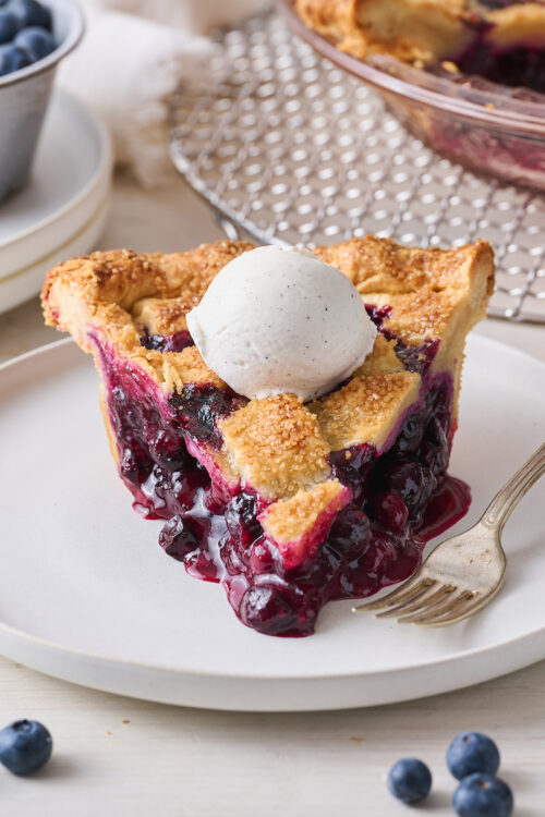 Nothing says "it's Summer!" quite like homemade blueberry pie topped with vanilla ice cream! Fresh or frozen berries will work, but I prefer fresh. So bust out your rolling pin and let's bake the pie!